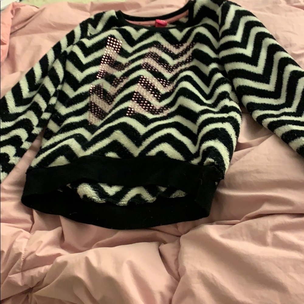 Black and white fuzzy sweatshirt says LOVE